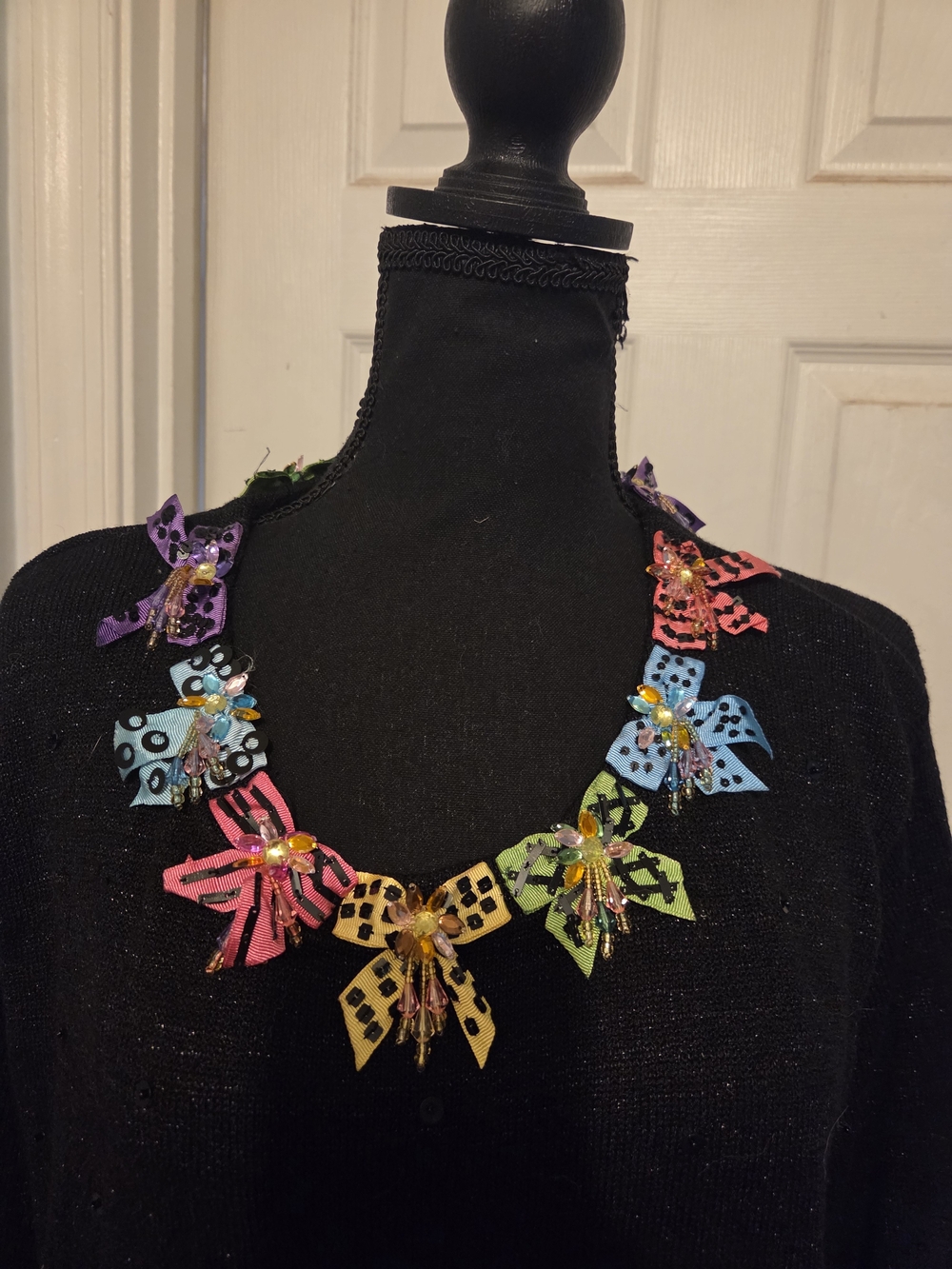 Black Crew Neck Sweater with Colorful Bow Accents - Picture 2 of 6